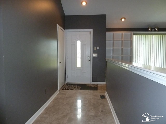 entryway with tile patterned floors