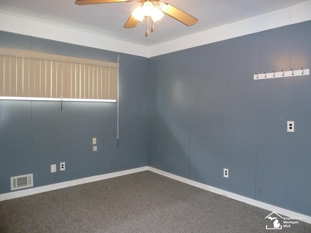 carpeted empty room featuring ceiling fan