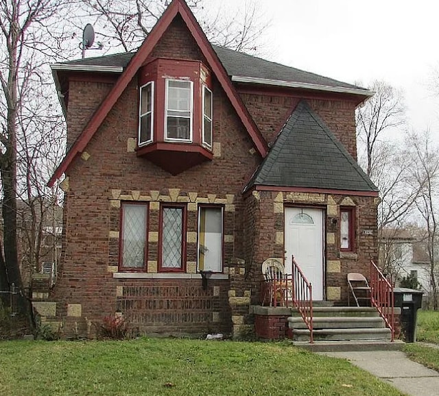 tudor house with a front lawn