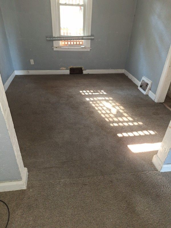 empty room with dark carpet