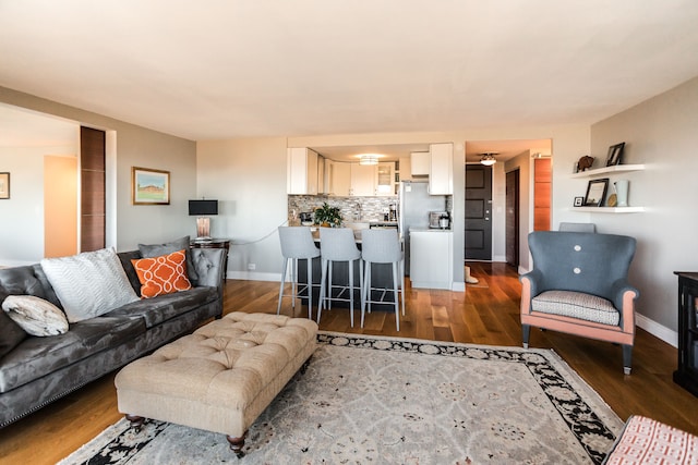 living room featuring dark wood-type flooring