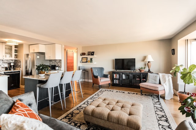 living room with dark hardwood / wood-style flooring