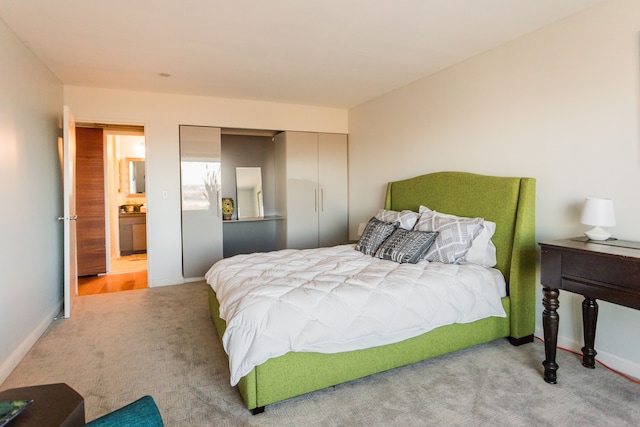 carpeted bedroom with a closet