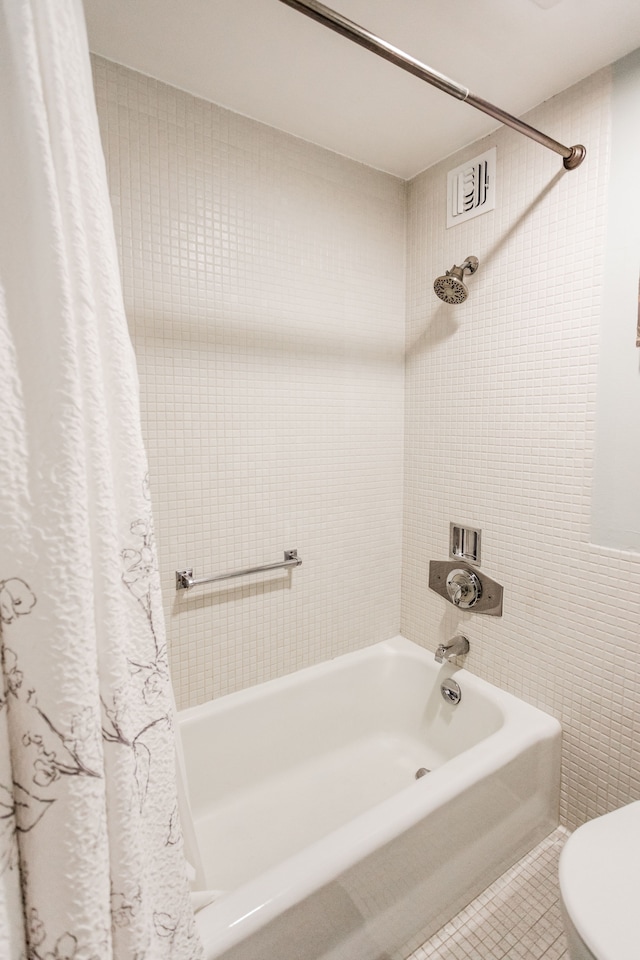 bathroom with tile patterned flooring and shower / bathtub combination with curtain