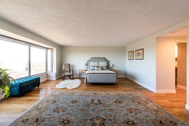 bedroom with light hardwood / wood-style flooring