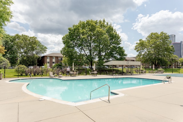 view of swimming pool with a patio