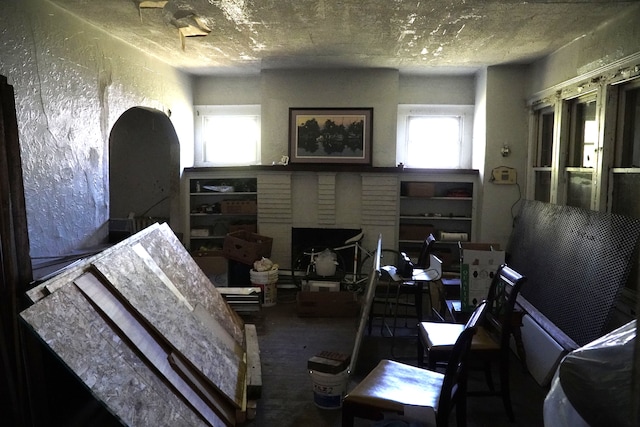 miscellaneous room with a textured ceiling