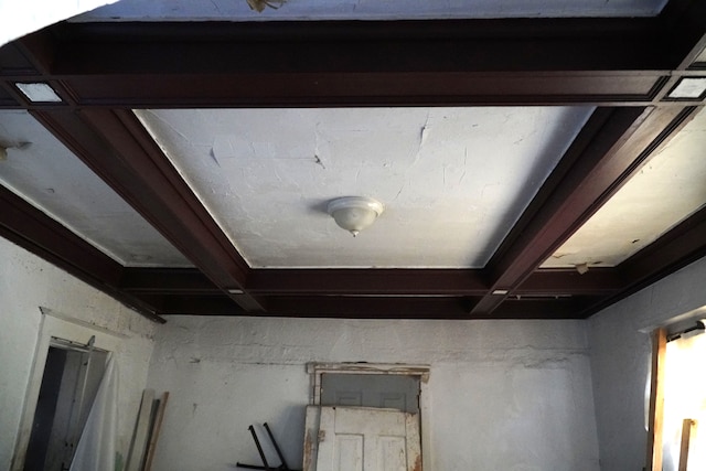 interior details featuring beamed ceiling and coffered ceiling