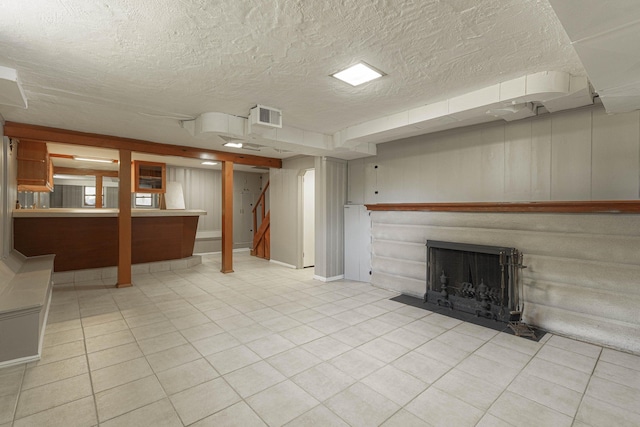 unfurnished living room featuring a textured ceiling