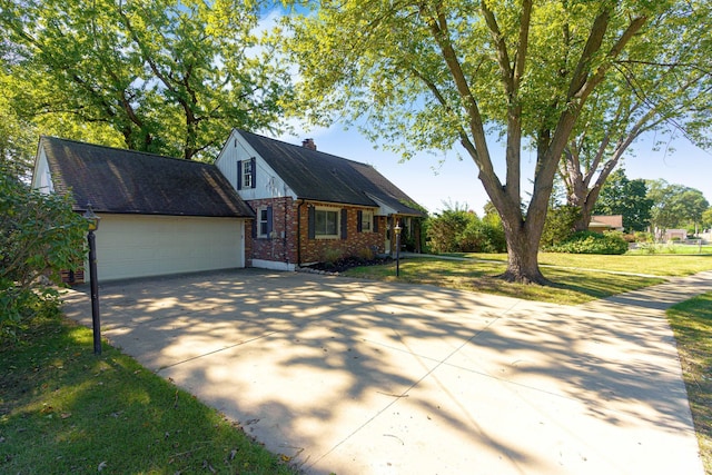 view of front of house featuring a garage and a front lawn