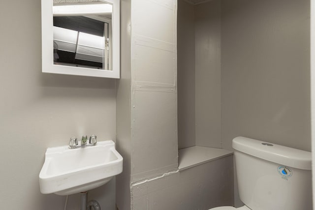 bathroom featuring sink and toilet