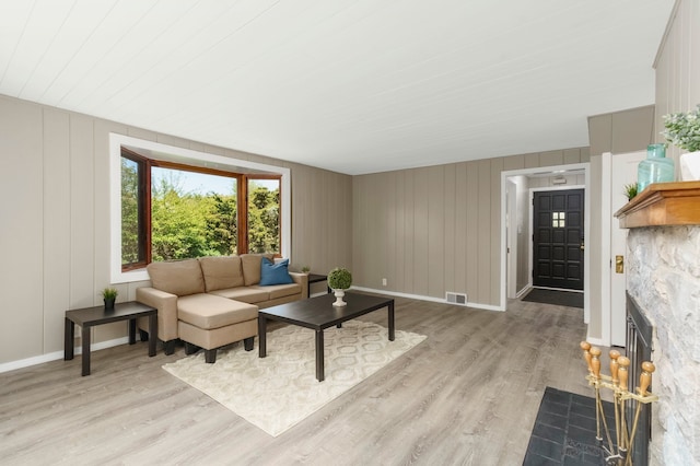 5721 Corunna Ave, Clarkston, MI 48346 - living area featuring light wood finished floors, baseboards, and wood ceiling