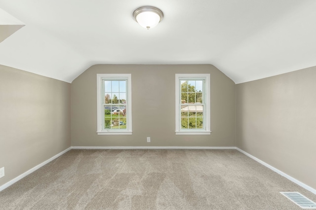 5721 Corunna Ave, Clarkston, MI 48346 - additional living space featuring lofted ceiling, carpet floors, and baseboards