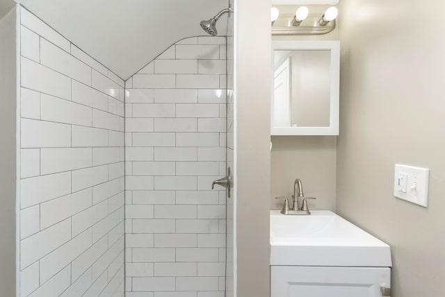5721 Corunna Ave, Clarkston, MI 48346 - full bath featuring a tile shower, vanity, and vaulted ceiling