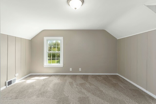 5721 Corunna Ave, Clarkston, MI 48346 - bonus room featuring vaulted ceiling, carpet flooring, and baseboards