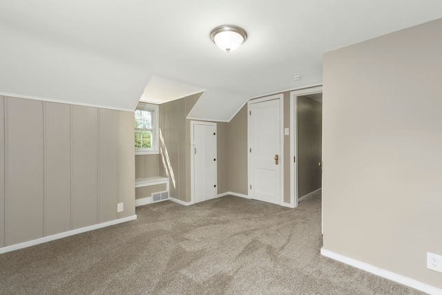 5721 Corunna Ave, Clarkston, MI 48346 - bonus room with lofted ceiling, carpet flooring, and baseboards
