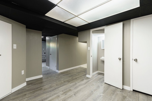 5721 Corunna Ave, Clarkston, MI 48346 - finished basement featuring light wood-type flooring and baseboards