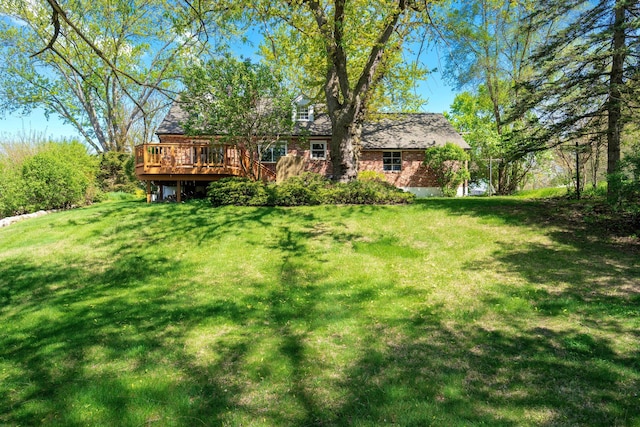 5721 Corunna Ave, Clarkston, MI 48346 - view of green lawn with a deck