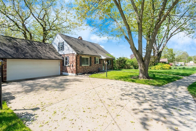 5721 Corunna Ave, Clarkston, MI 48346 - view of front of house with brick siding, driveway, a front lawn, and a garage