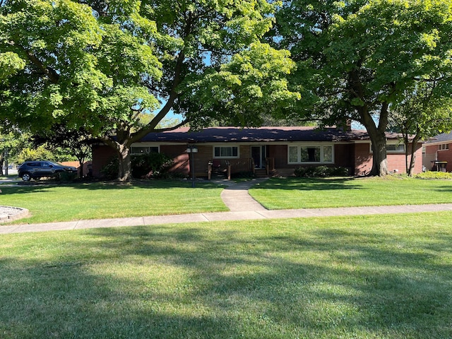 ranch-style home with a front yard