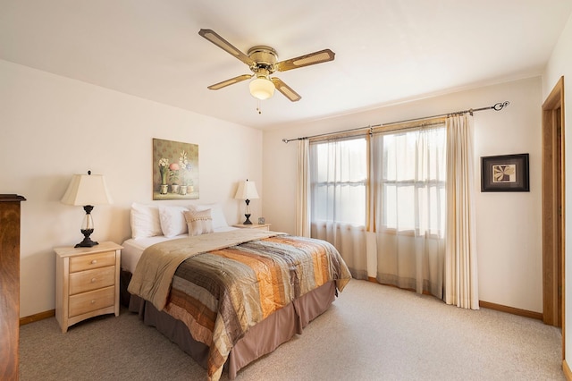 bedroom featuring ceiling fan and light colored carpet