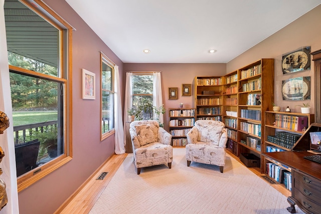 sitting room with light hardwood / wood-style floors