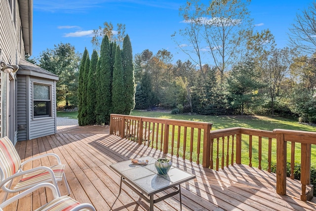 wooden terrace with a yard