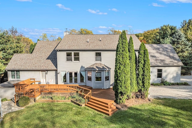 back of house featuring a yard and a deck