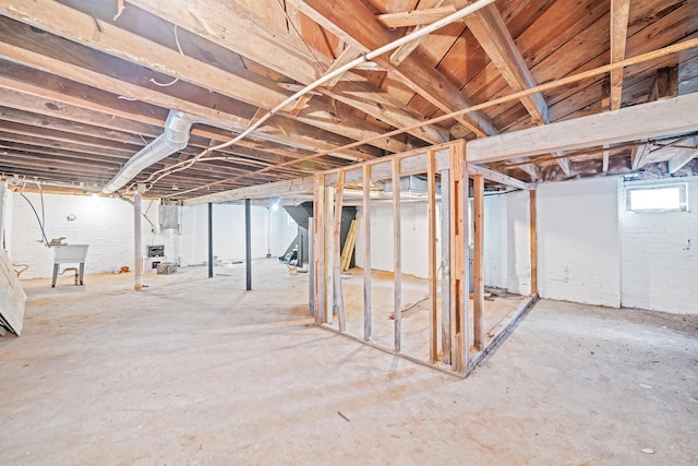 basement with electric panel and sink