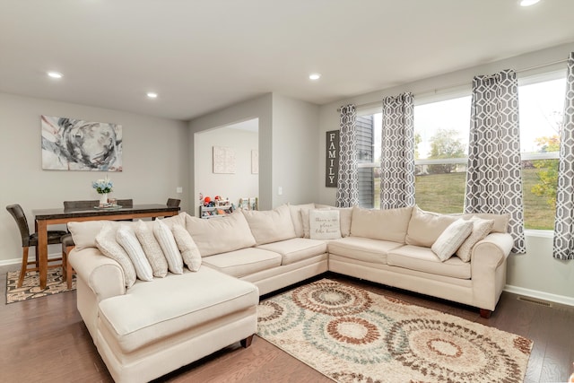 living room with dark hardwood / wood-style floors