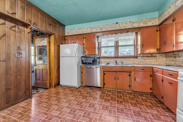 kitchen with decorative backsplash, sink, and appliances with stainless steel finishes