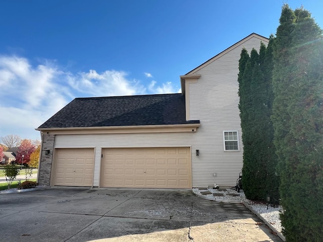 view of side of property featuring a garage