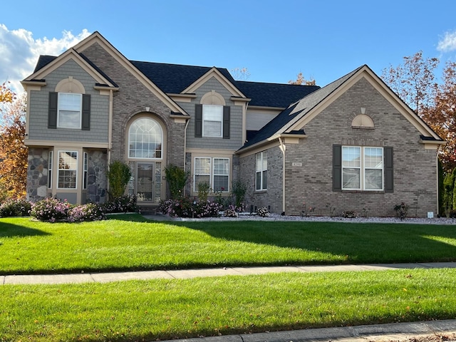 front facade with a front lawn