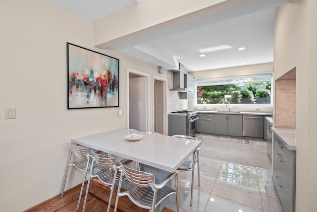 dining space featuring light hardwood / wood-style floors and sink