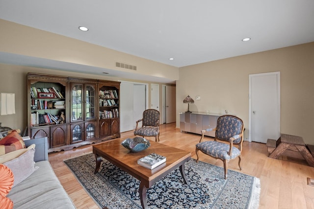 living room with light hardwood / wood-style flooring