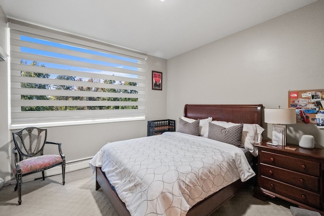 bedroom featuring light carpet and lofted ceiling