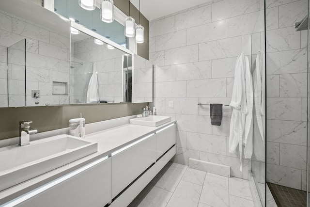 bathroom featuring vanity, a tile shower, and tile walls