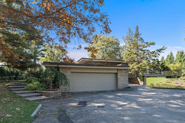 view of side of home with a garage