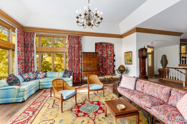 living room featuring a chandelier, vaulted ceiling, and hardwood / wood-style flooring