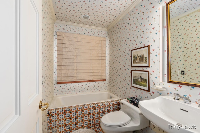 bathroom featuring a relaxing tiled tub, toilet, sink, and crown molding