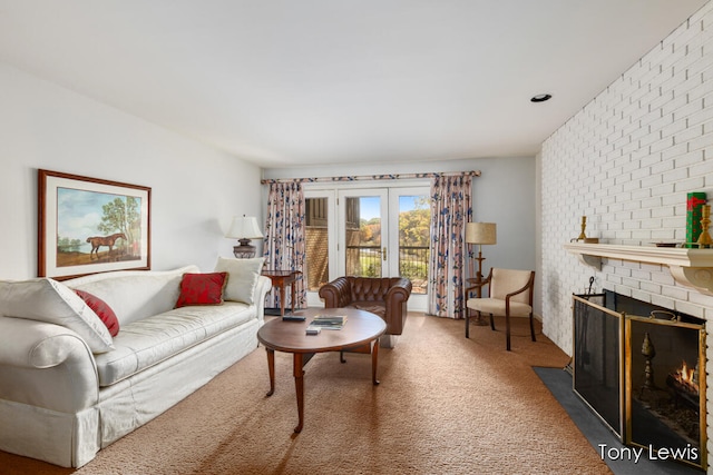 living room with carpet and a brick fireplace