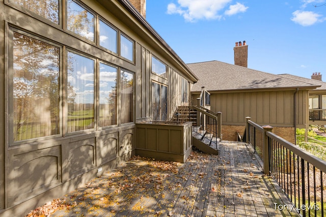 view of side of property with a wooden deck