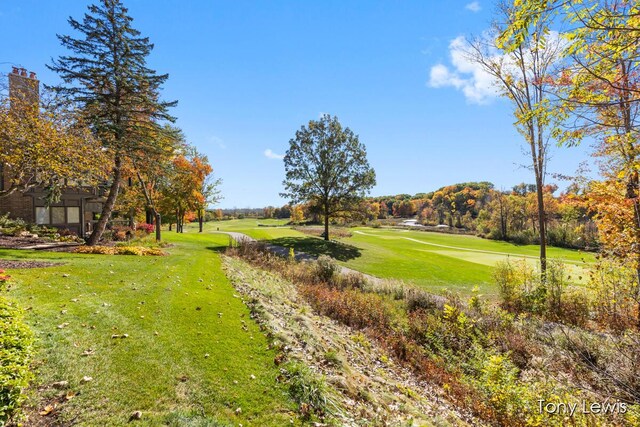 610 Cascade Hills Holw SE, Grand Rapids, MI 49546 - surrounding community featuring a yard and view of golf course