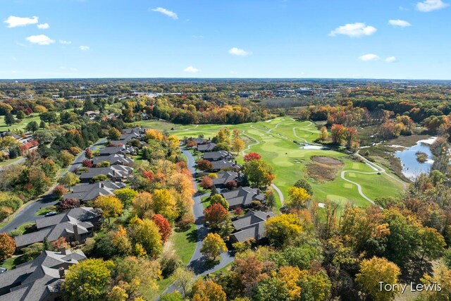 610 Cascade Hills Holw SE, Grand Rapids, MI 49546 - aerial view of property's location featuring a local golf course, nearby suburban area, a large body of water, and a tree filled landscape