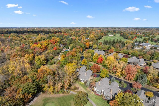 610 Cascade Hills Holw SE, Grand Rapids, MI 49546 - aerial view of property and surrounding area with nearby suburban area and a forest
