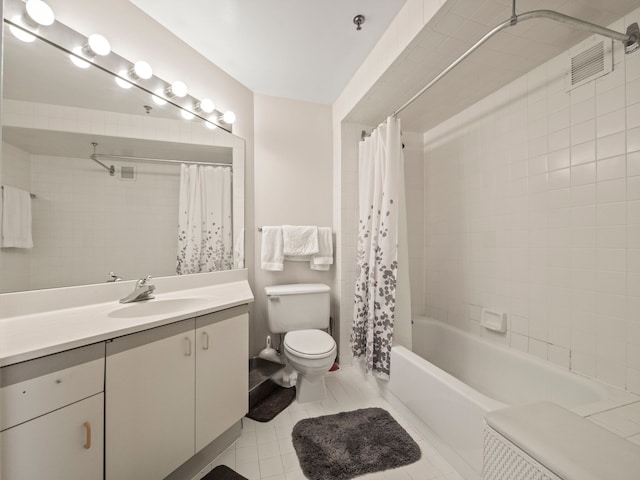 full bathroom featuring tile patterned floors, vanity, shower / bath combination with curtain, and toilet