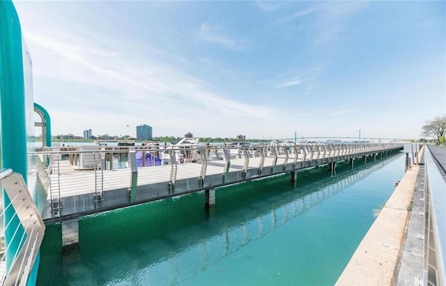 view of swimming pool featuring a water view