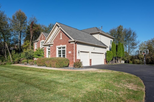 view of side of property featuring a garage and a lawn