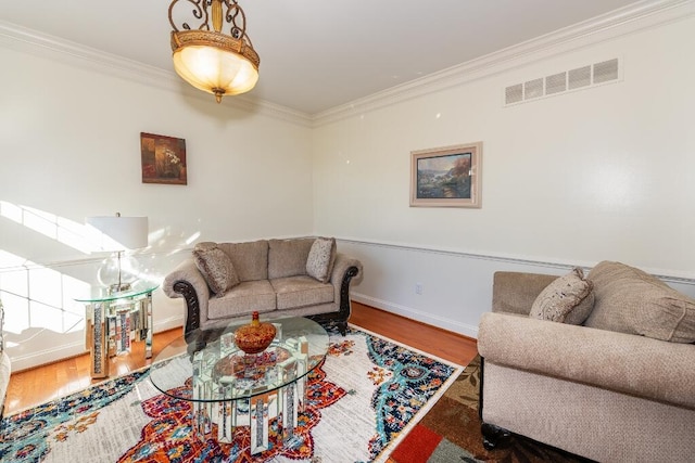 living room featuring hardwood / wood-style floors and ornamental molding