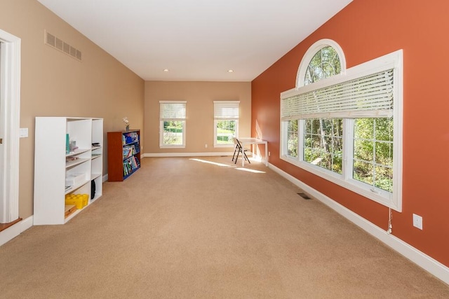 game room featuring plenty of natural light and carpet floors